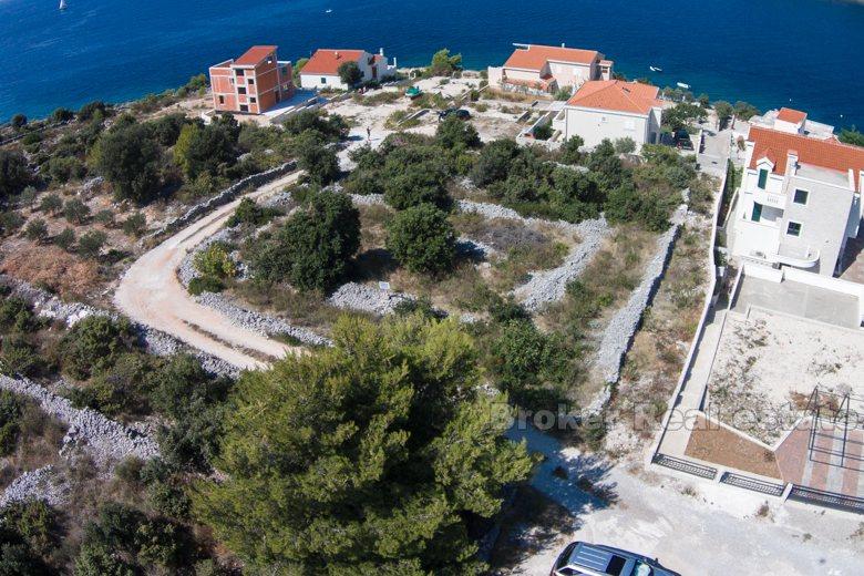 Building land plot at third row from the sea