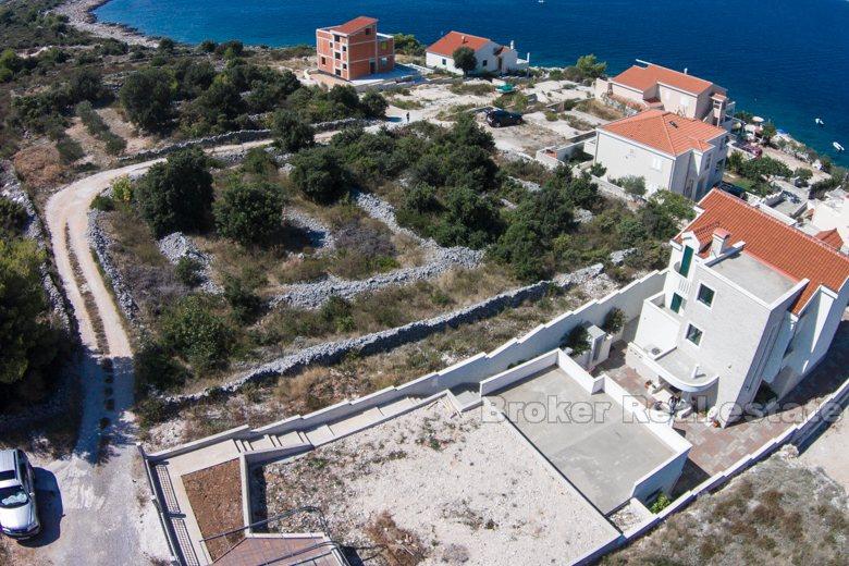 Building land plot at third row from the sea