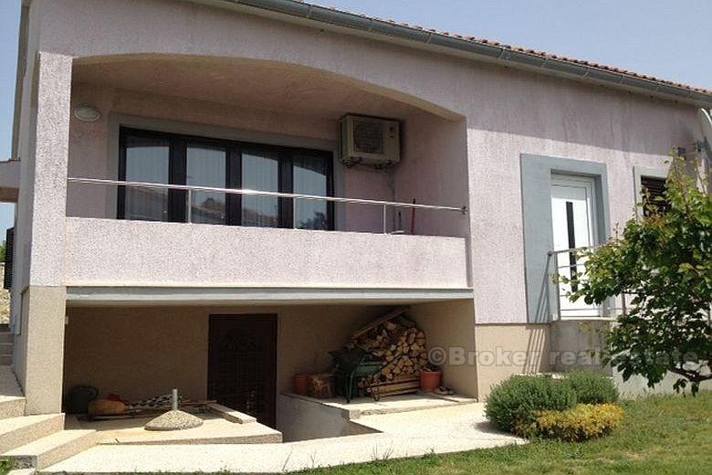 House with land by the sea