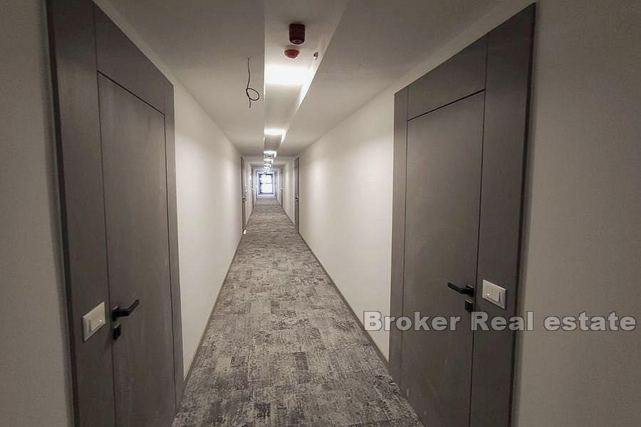 Tvårumslägenheter i nybyggnad med pool