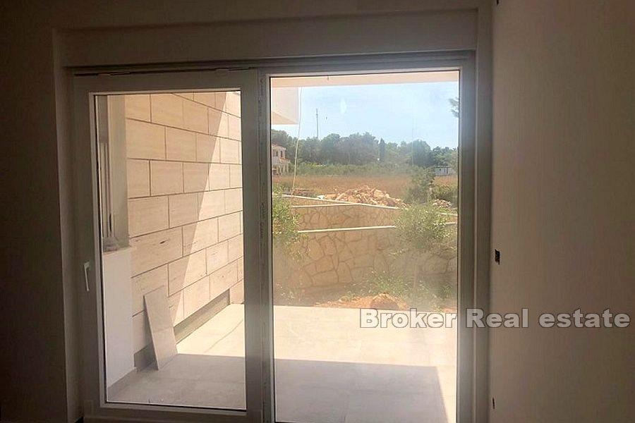 Three-storey apartment with a yard