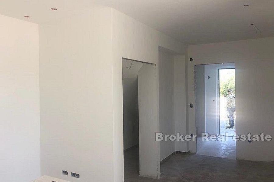 Three-storey apartment with a yard