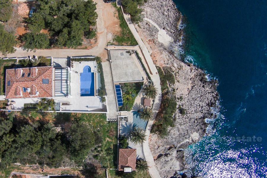 Beautiful villa at first row the sea sea