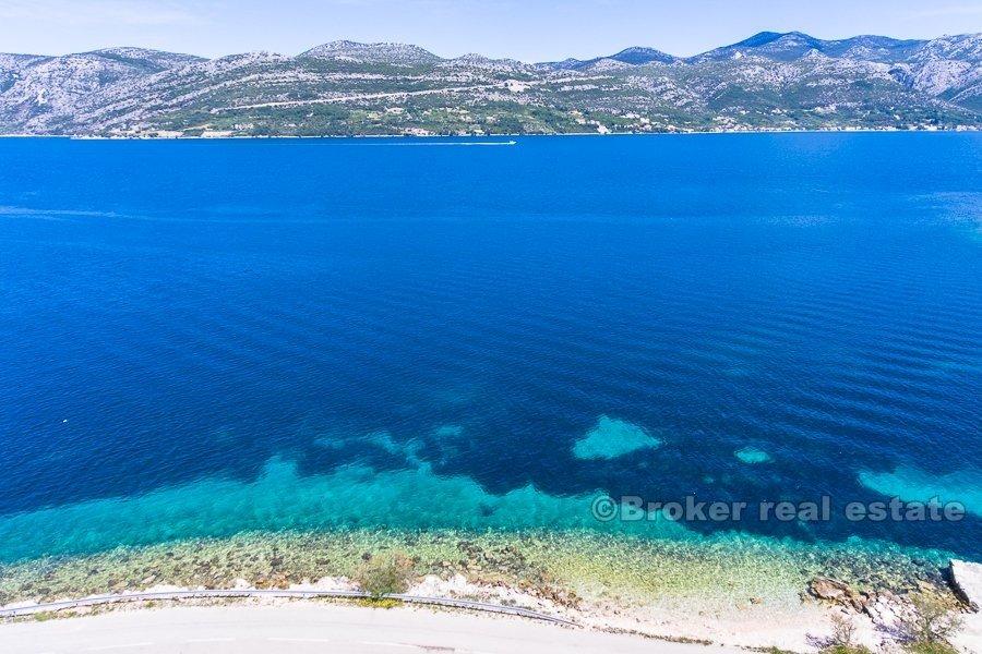Terrain à bâtir, première rangée à la mer, à vendre