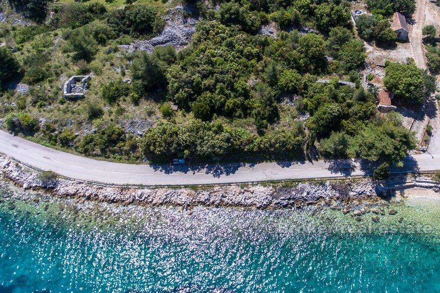 Terrain à bâtir, première rangée à la mer, à vendre