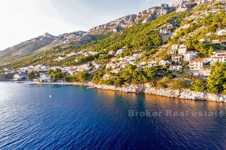 Unfinished house in the first row to the sea