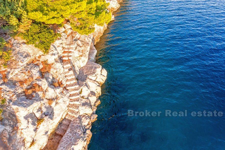 Unfinished house in the first row to the sea