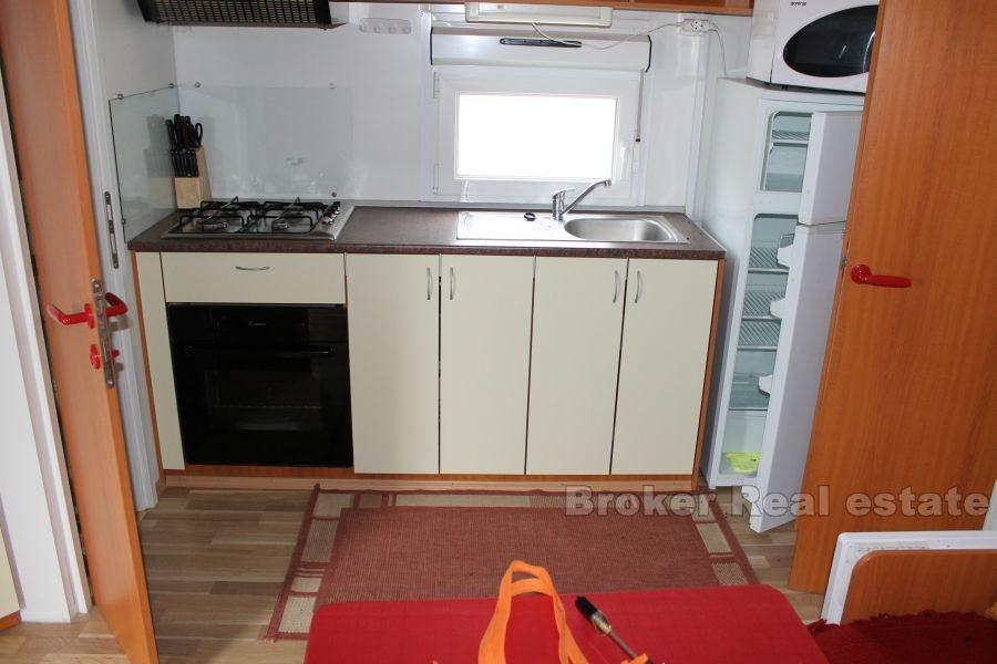 Building land with prefabricated house, for sale