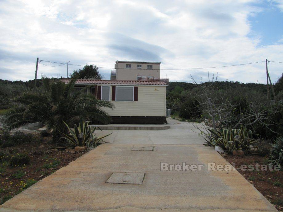 Building land with prefabricated house, for sale
