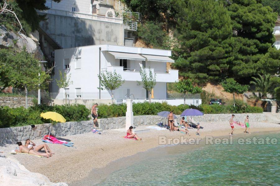 House first row by the sea