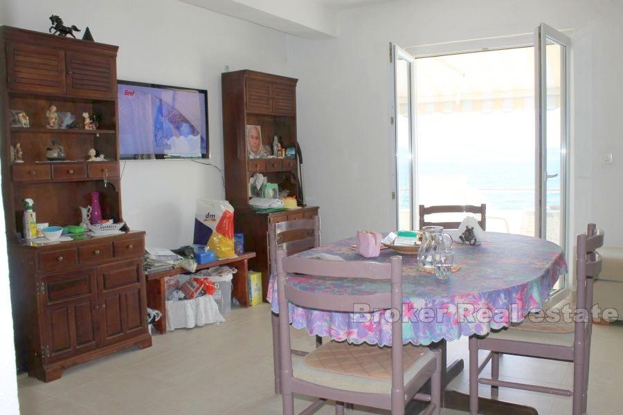 House first row by the sea