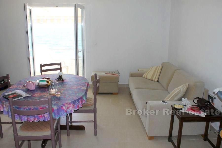 House first row by the sea