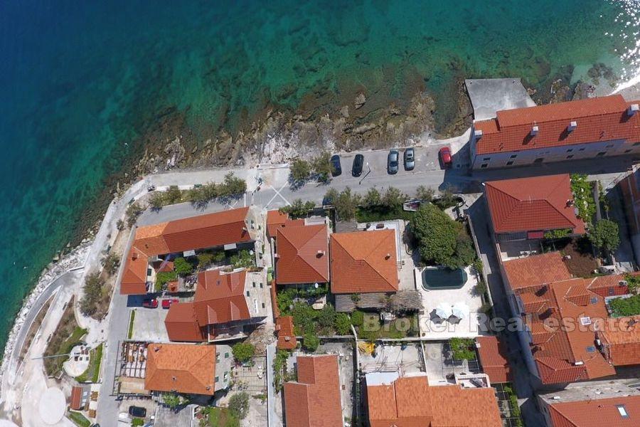 House with pool, first row by the sea