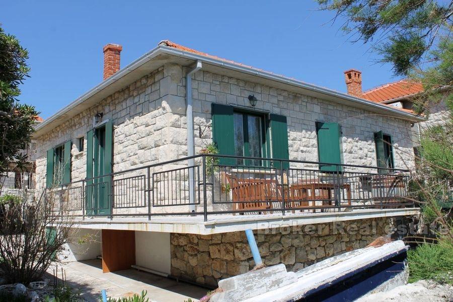 House with pool, first row by the sea