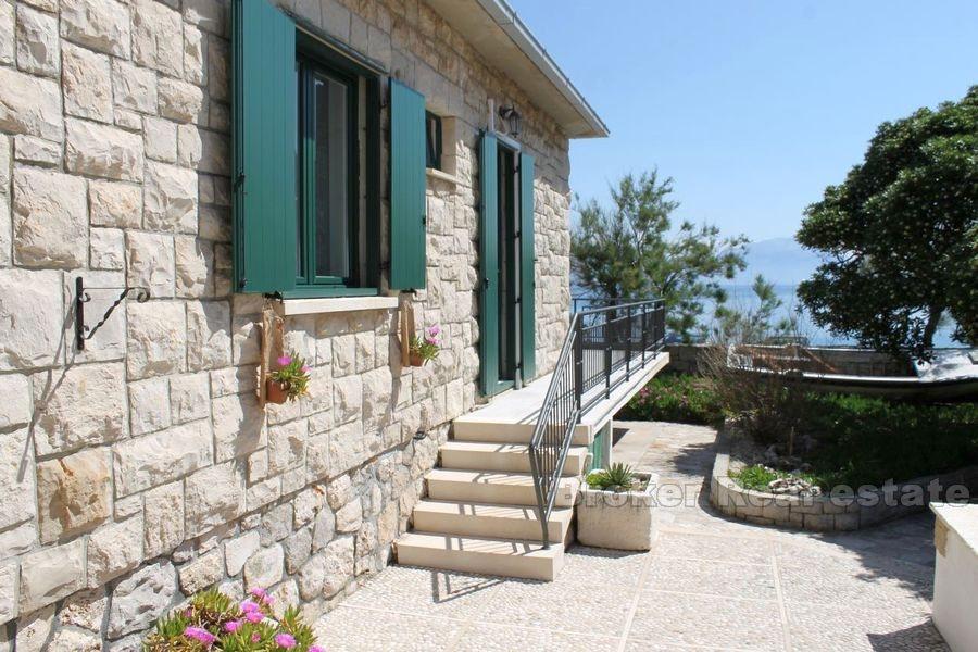 House with pool, first row by the sea