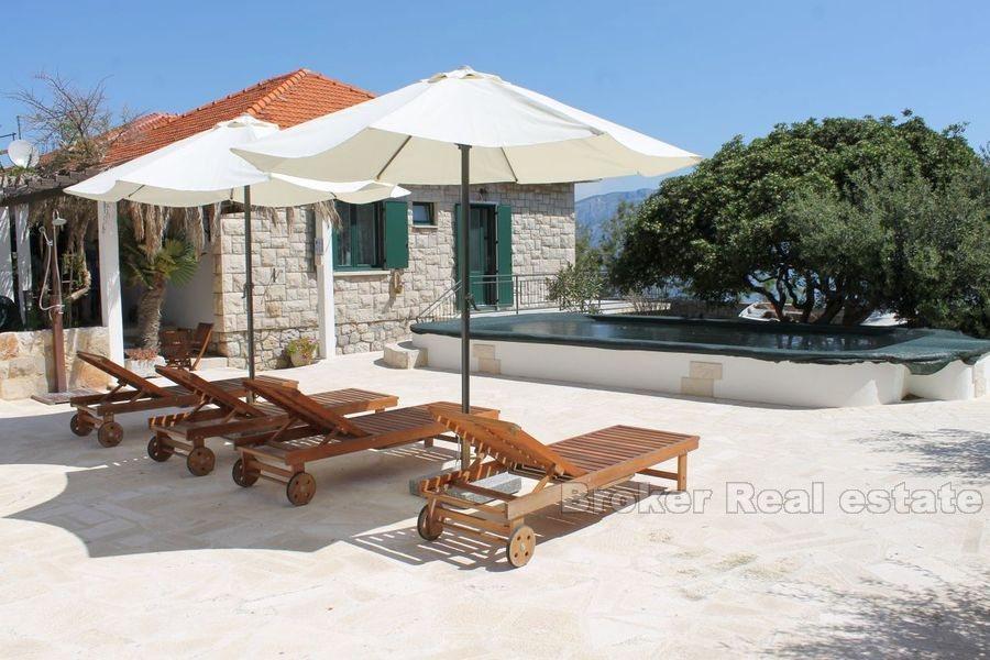 House with pool, first row by the sea