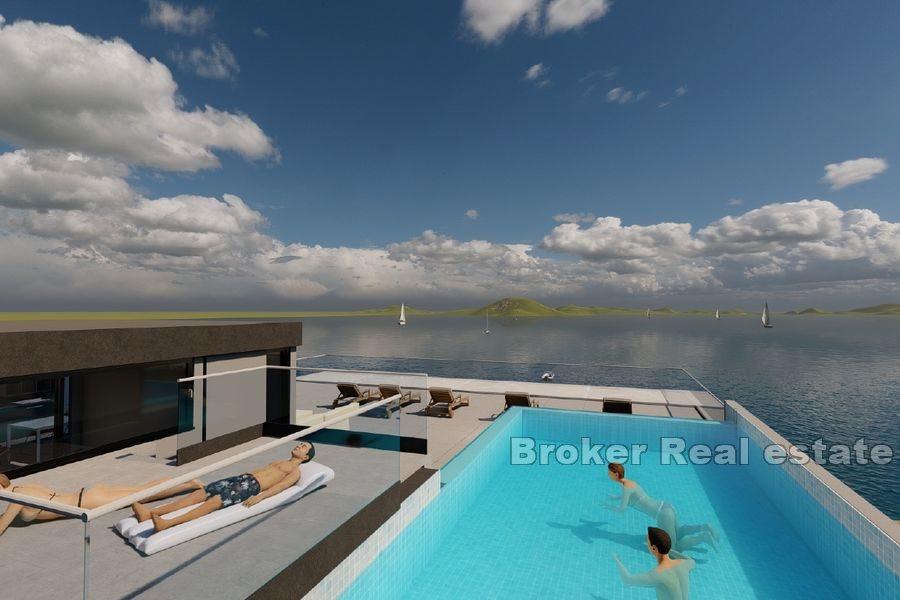 Apartment with pool first row to the sea