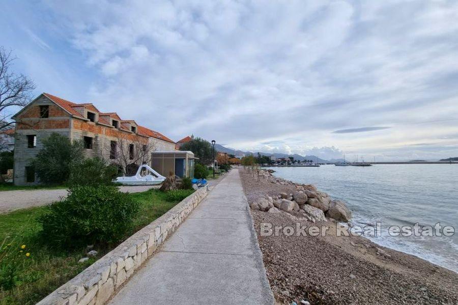 Unfinished house in the first row by the sea on three floors