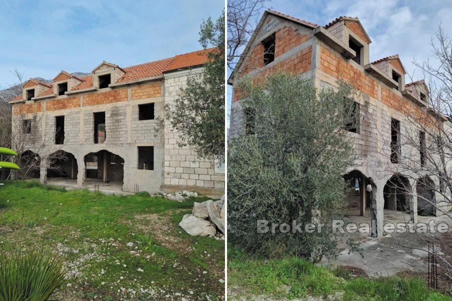 Unfinished house in the first row by the sea on three floors
