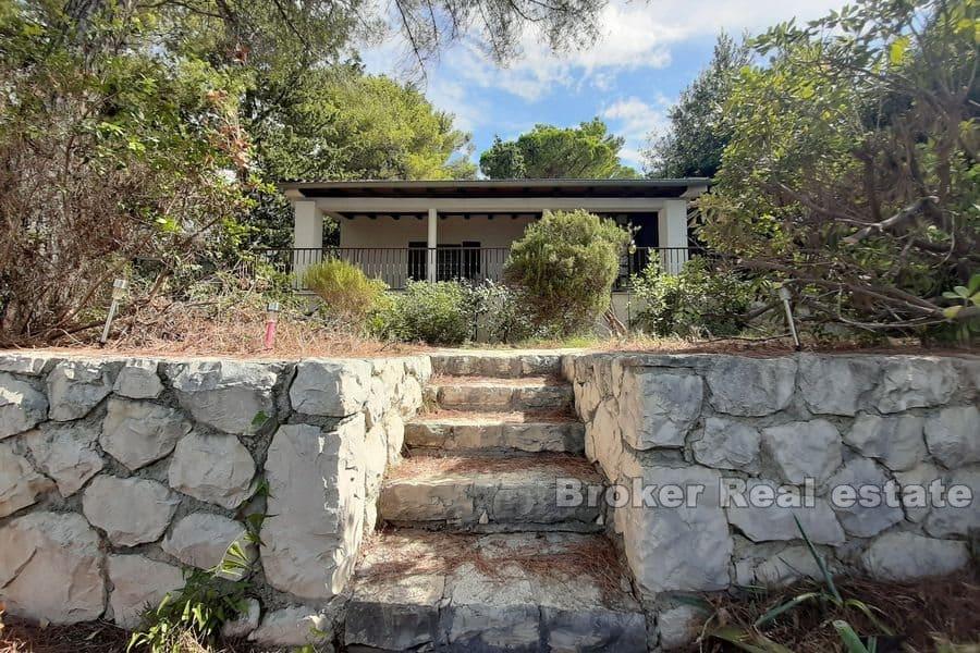 House in the first row by the sea