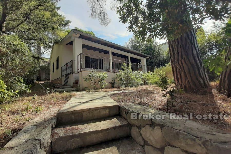 House in the first row by the sea