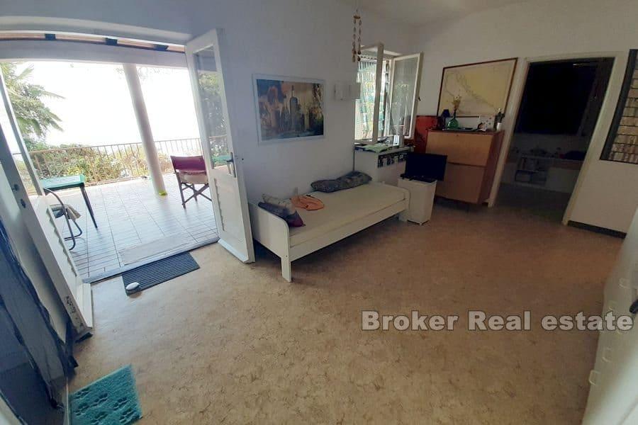 House in the first row by the sea