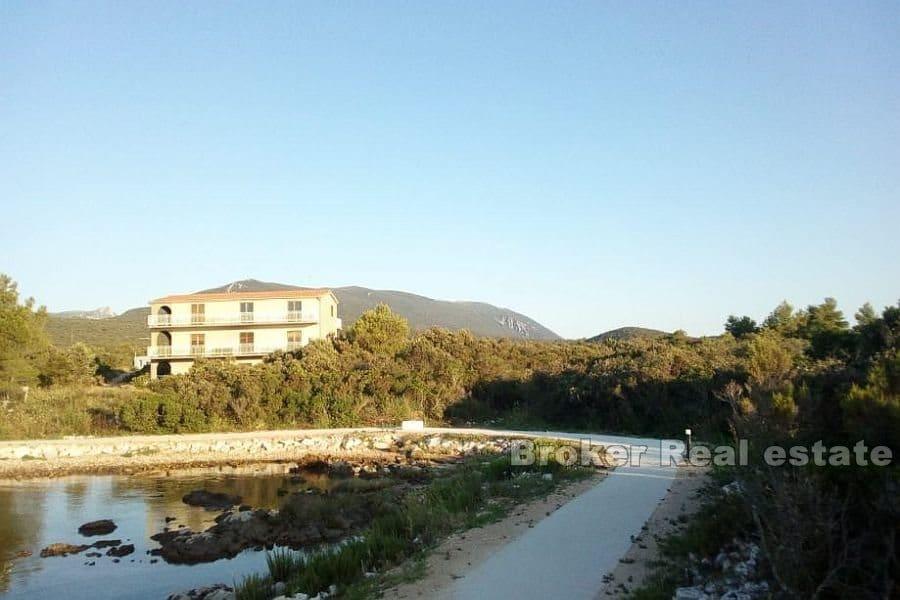 Land in the first row by the sea