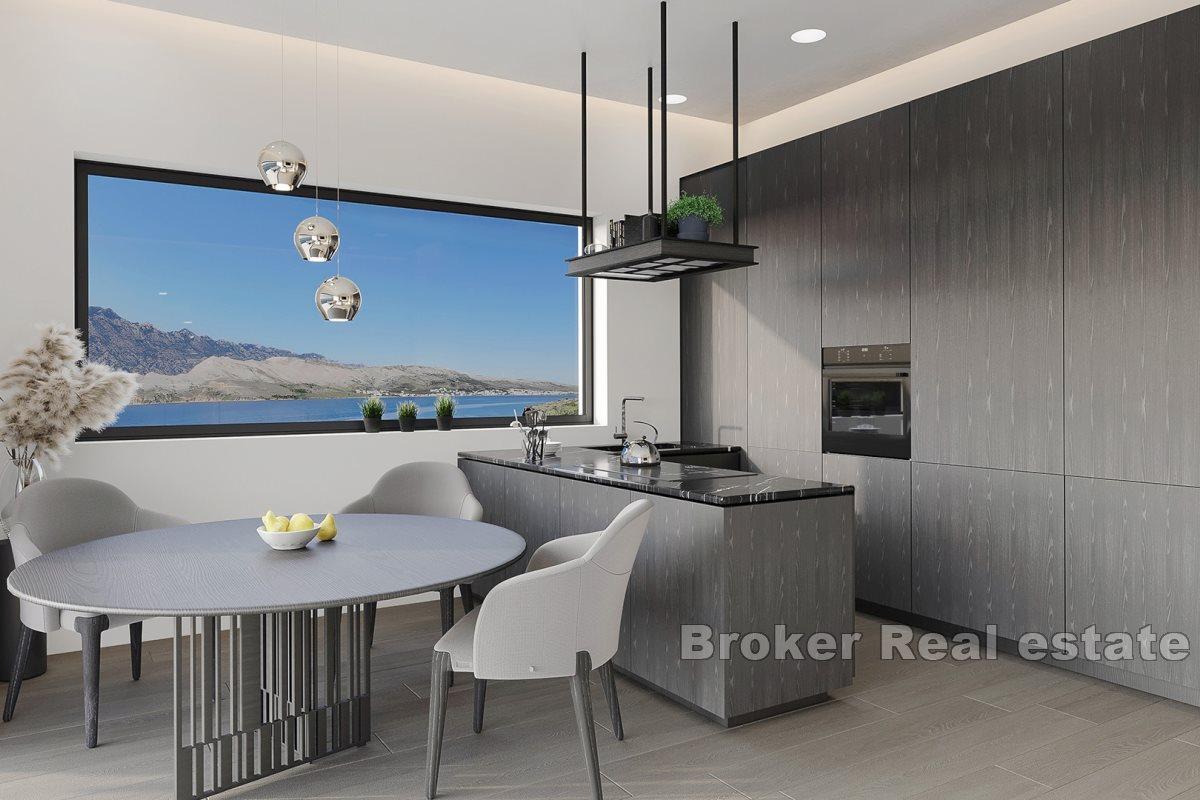 Modern apartments in a new building with a pool and a view of the sea