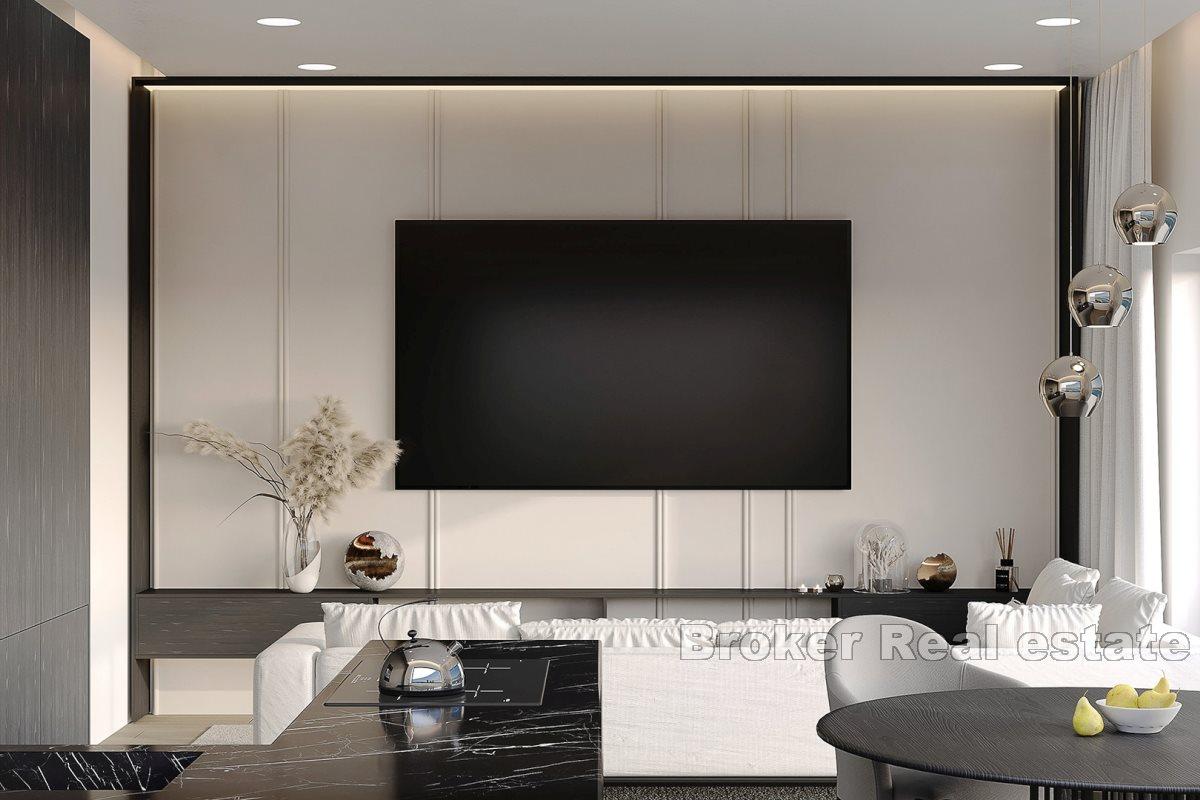 Modern apartments in a new building with a pool and a view of the sea