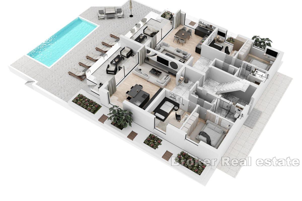 Modern apartments in a new building with a pool and a view of the sea