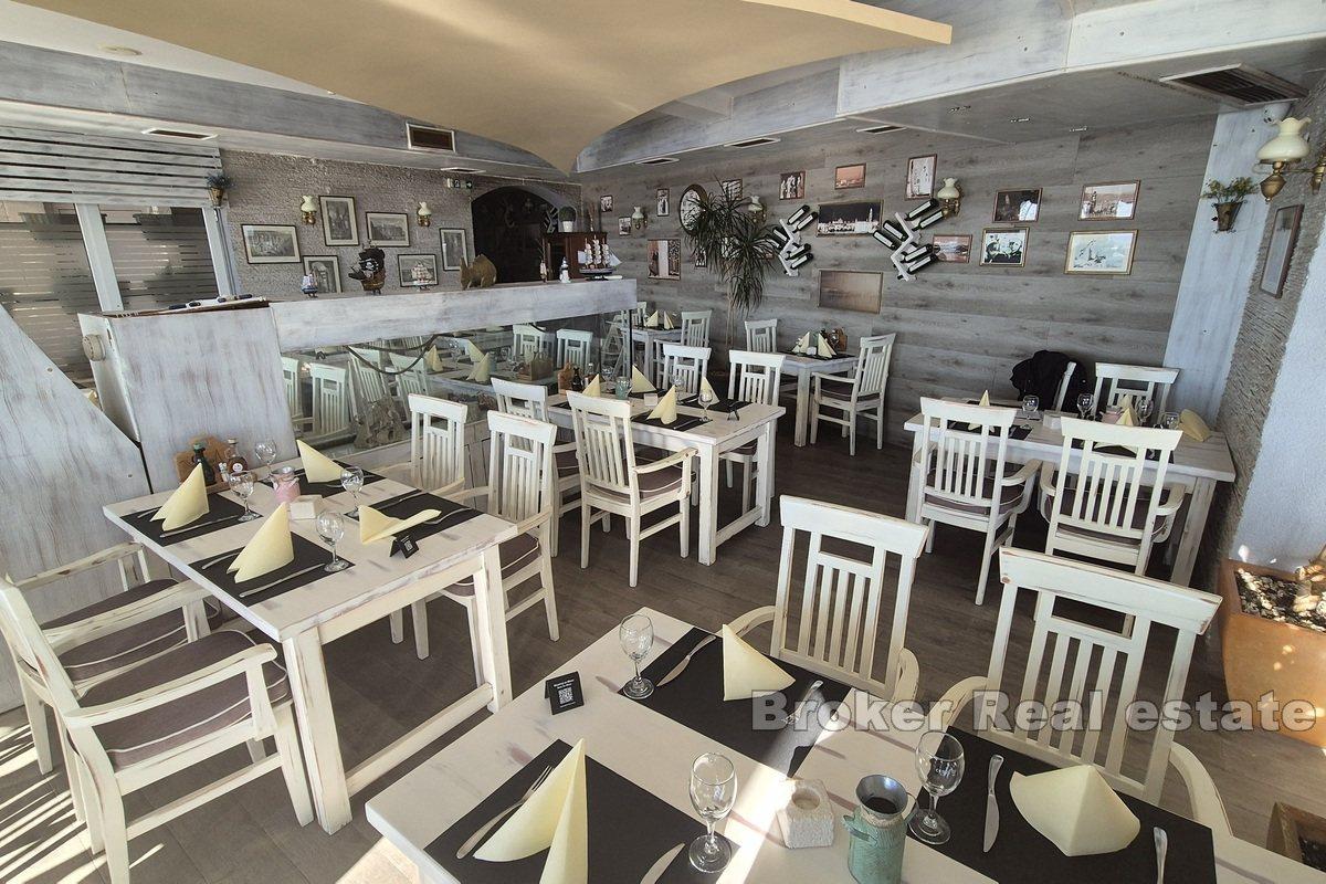 Top-positioned restaurant in the first row by the sea