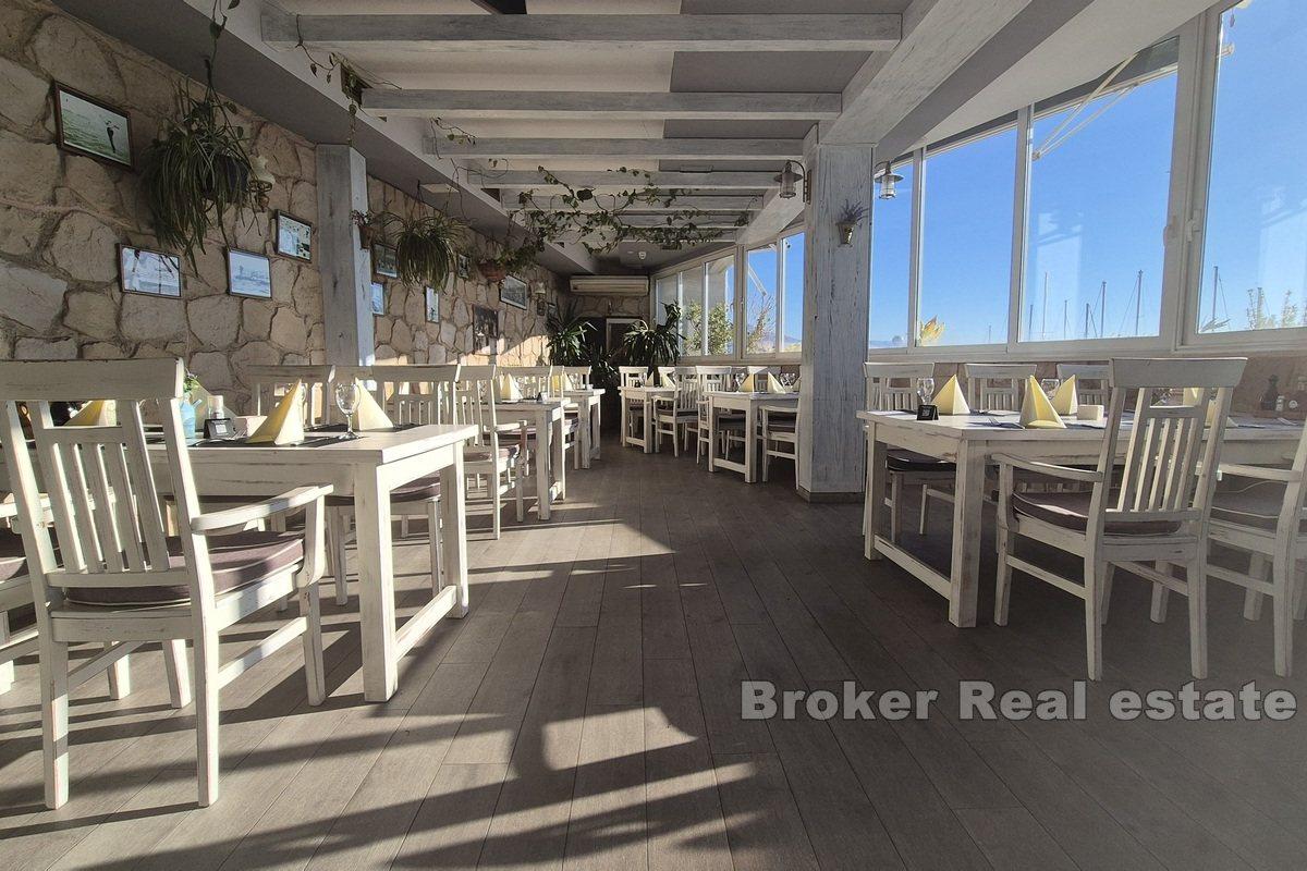 Top-positioned restaurant in the first row by the sea