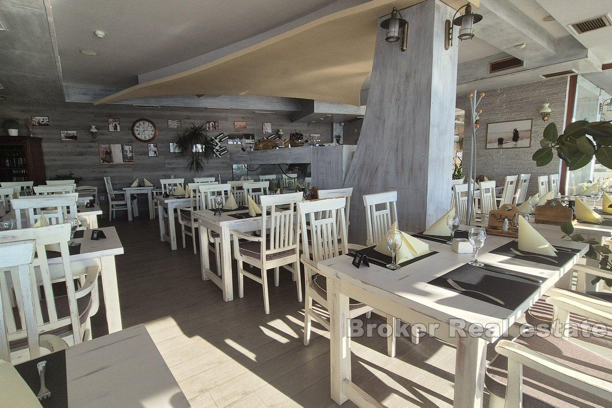 Top-positioned restaurant in the first row by the sea