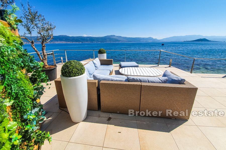 Villa on the beach with spacious terraces and sea view