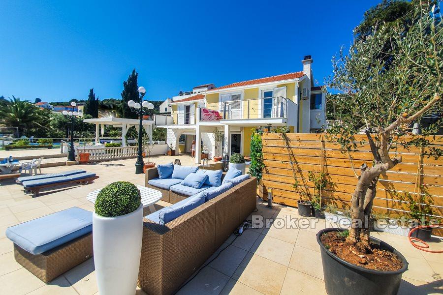 Villa on the beach with spacious terraces and sea view