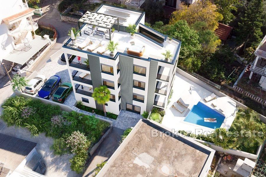 Apartments in a new building next to the sea and the beach