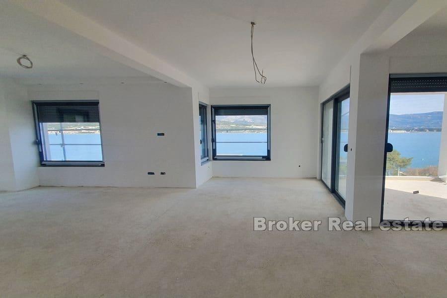 Apartments in a new building next to the sea and the beach