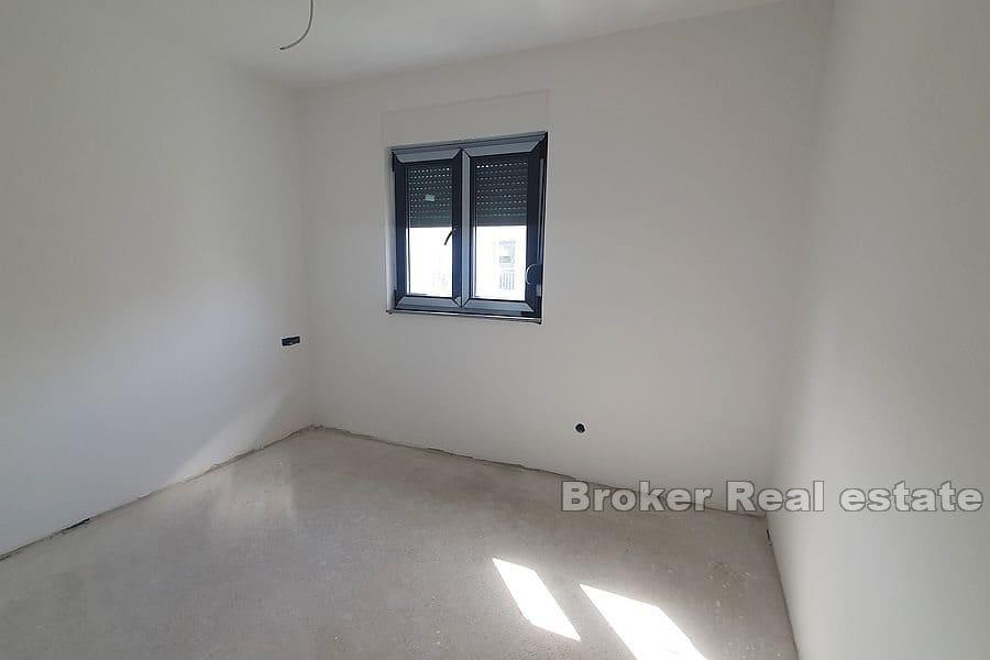 Apartments in a new building next to the sea and the beach