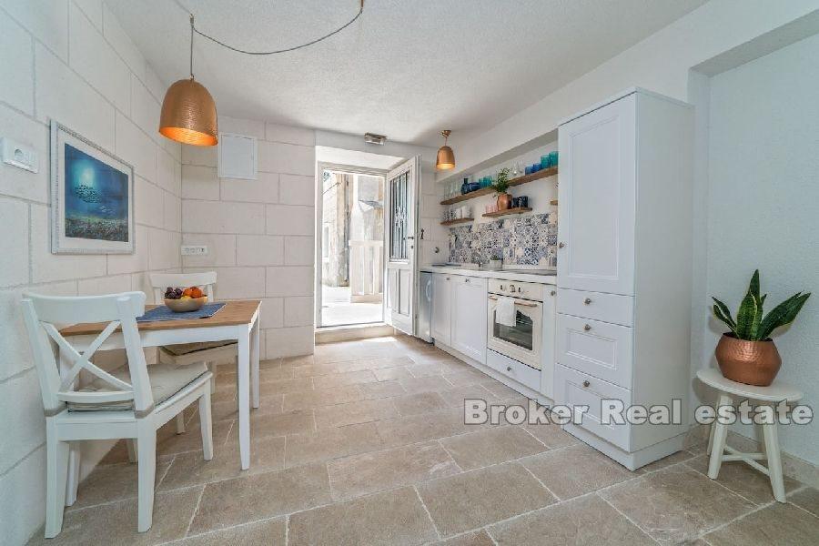 Stone house near the waterfront and the sea