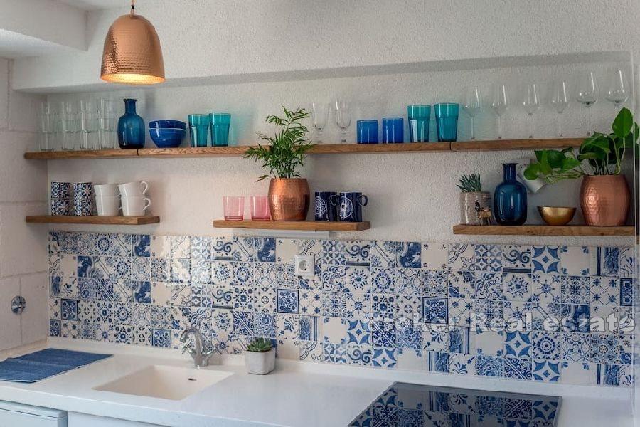 Stone house near the waterfront and the sea