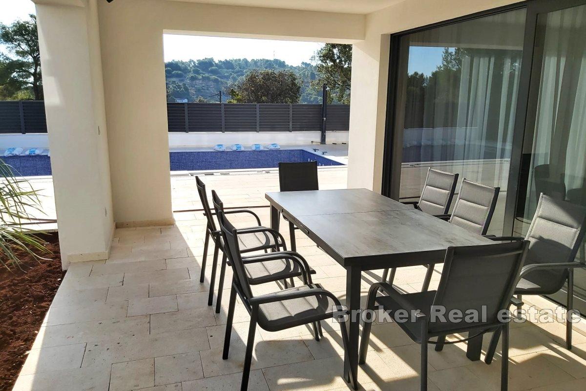 Newly built villa with a pool and a sea view