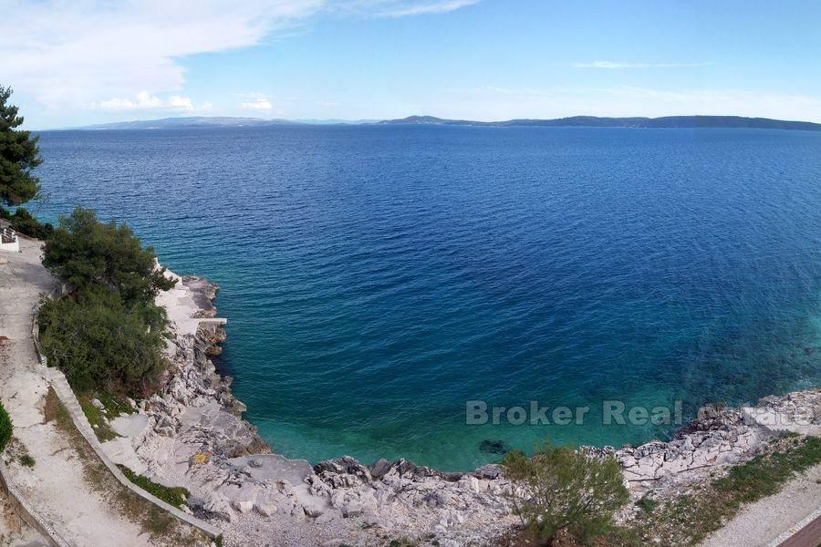 Lägenhet hus med pool första raden till havet