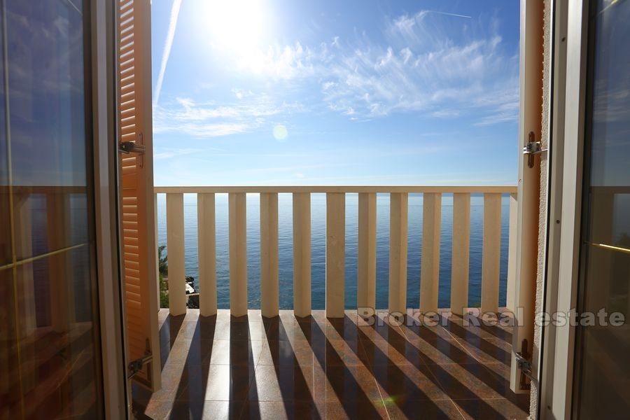 Apartment house with pool first row to the sea