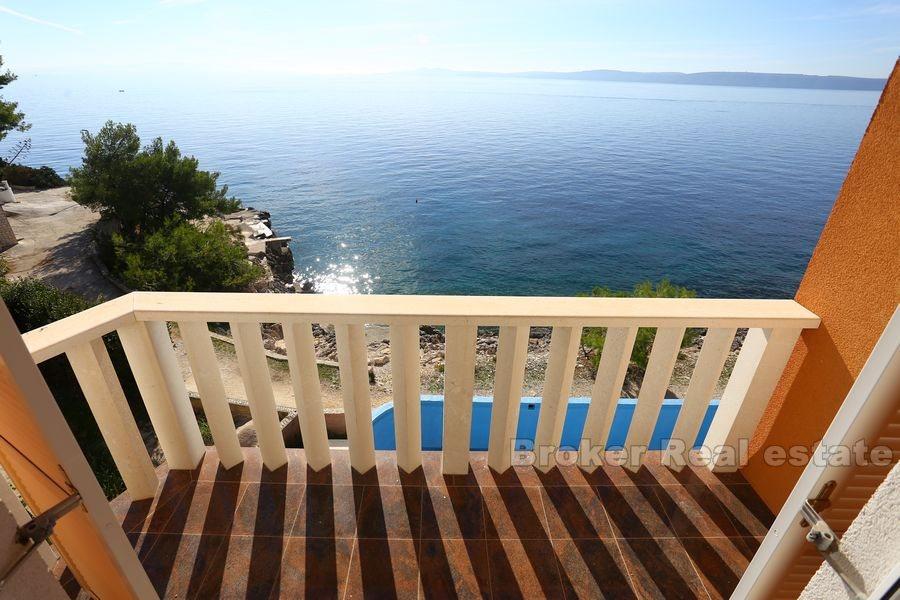 Apartment house with pool first row to the sea