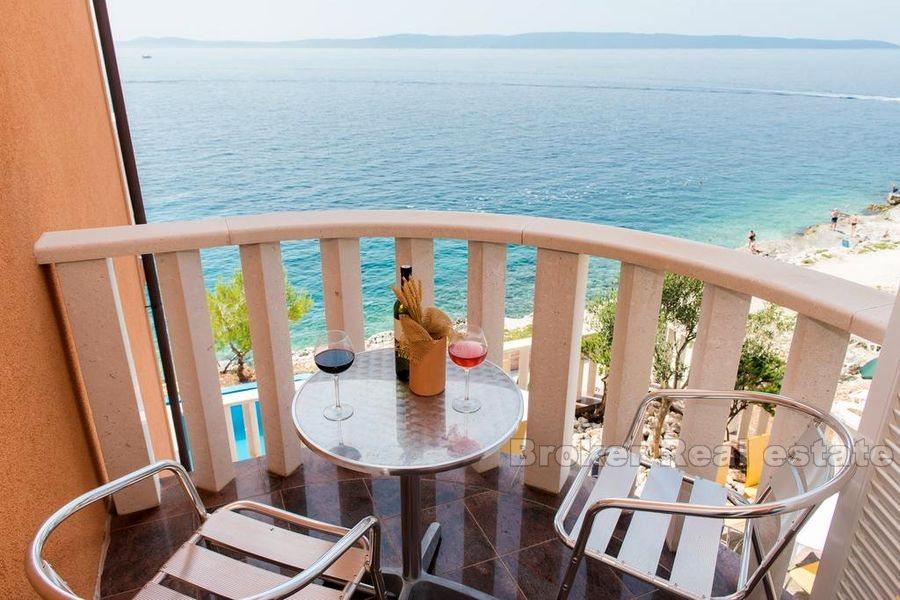 Apartment house with pool first row to the sea