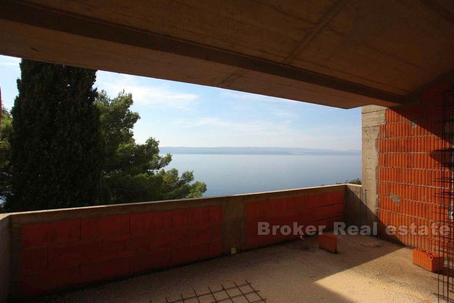 Unfinished house first row to the sea