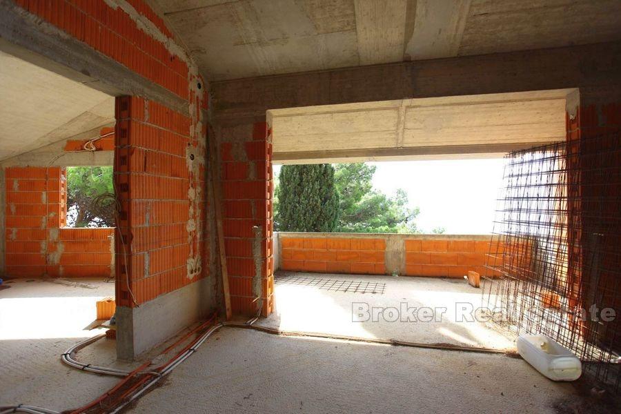 Unfinished house first row to the sea