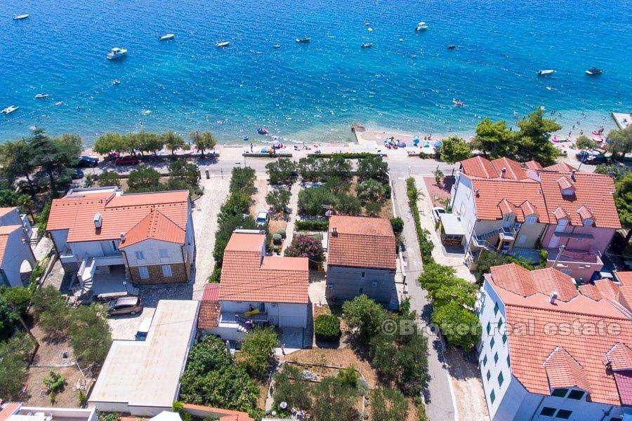 Two houses on a larger plot, by the sea, for sale.