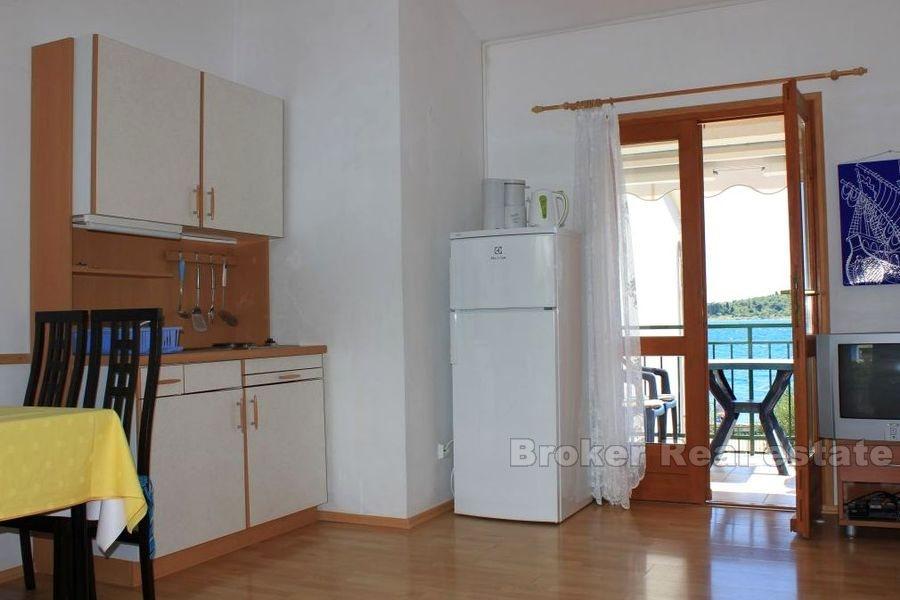 Two houses on a larger plot, by the sea, for sale.