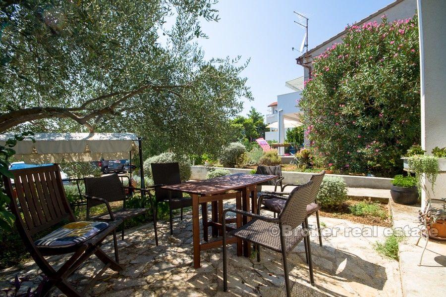 Two houses on a larger plot, by the sea, for sale.